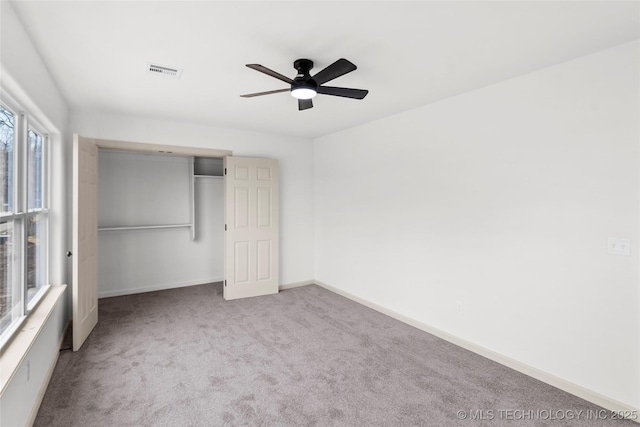 2002 W Driftwood Dr, Claremore, OK 74017 - unfurnished bedroom featuring a closet, baseboards, carpet floors, visible vents, and ceiling fan