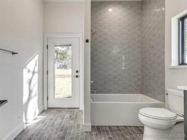 12415 Lakeview Rd, Sperry, OK 74073 - bathroom featuring toilet, bathing tub / shower combination, and baseboards