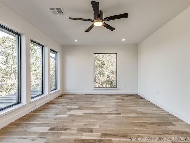12415 Lakeview Rd, Sperry, OK 74073 - spare room featuring light wood-type flooring, visible vents, and a wealth of natural light