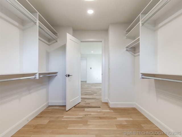 12415 Lakeview Rd, Sperry, OK 74073 - walk in closet featuring light wood finished floors