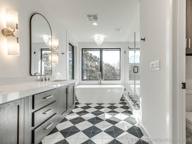 12415 Lakeview Rd, Sperry, OK 74073 - full bathroom featuring vanity, tile patterned floors, toilet, a shower stall, and visible vents