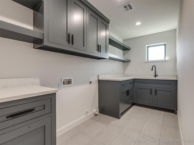 12415 Lakeview Rd, Sperry, OK 74073 - washroom with visible vents, washer hookup, a sink, hookup for an electric dryer, and cabinet space