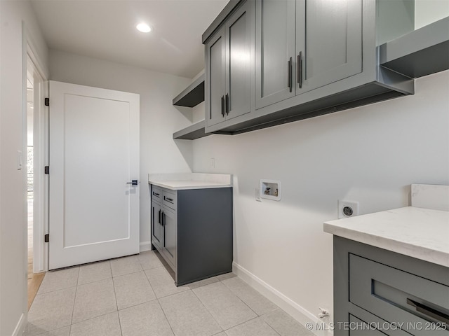 12415 Lakeview Rd, Sperry, OK 74073 - clothes washing area with light tile patterned floors, hookup for a washing machine, electric dryer hookup, recessed lighting, and baseboards