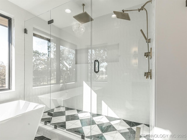 12415 Lakeview Rd, Sperry, OK 74073 - full bathroom with a shower stall, a freestanding tub, and recessed lighting