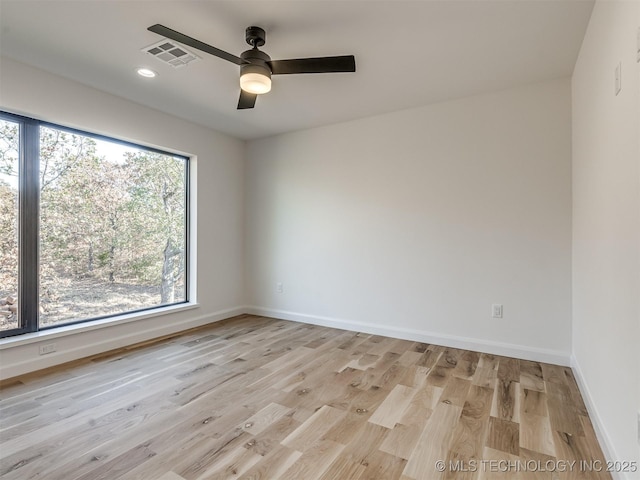 12415 Lakeview Rd, Sperry, OK 74073 - empty room with visible vents, baseboards, ceiling fan, light wood-style floors, and recessed lighting