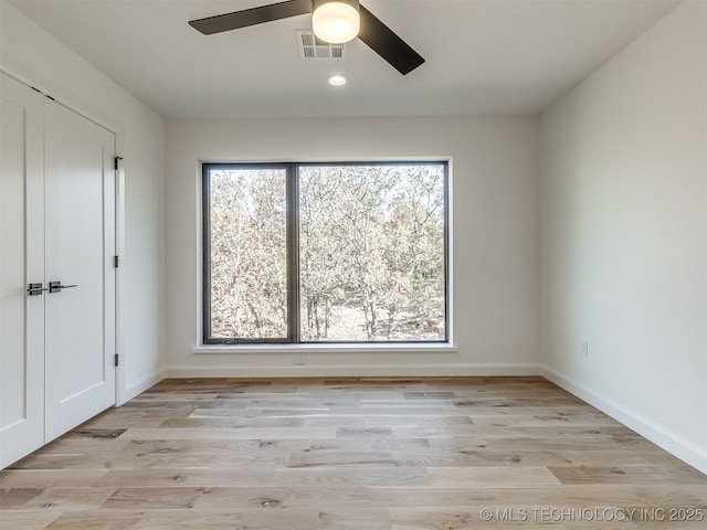 12415 Lakeview Rd, Sperry, OK 74073 - unfurnished room featuring visible vents, light wood-type flooring, baseboards, and ceiling fan