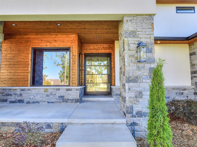12415 Lakeview Rd, Sperry, OK 74073 - property entrance with covered porch, stucco siding, and stone siding