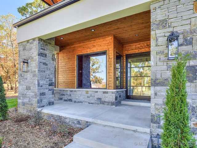 12415 Lakeview Rd, Sperry, OK 74073 - view of exterior entry with stone siding and covered porch