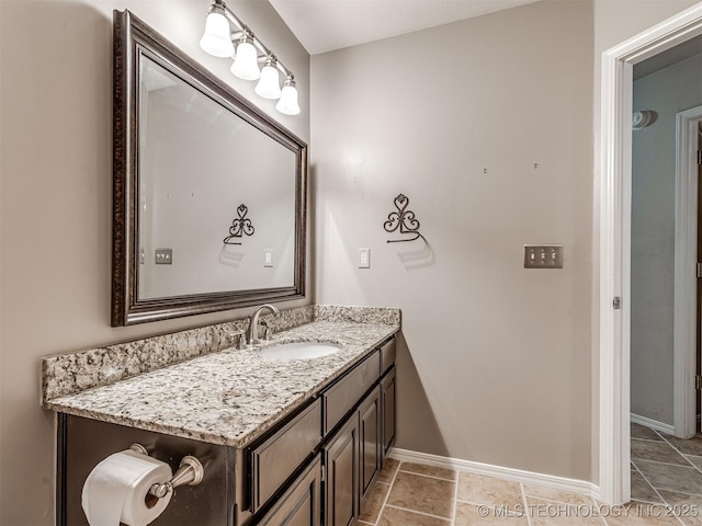 bathroom featuring vanity and baseboards