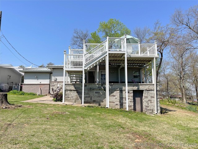 72036 S 324th Rd, Wagoner, OK 74467 - back of house with a deck, a yard, stairway, and central AC