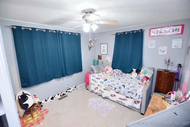 bedroom with ceiling fan, carpet floors, and baseboards