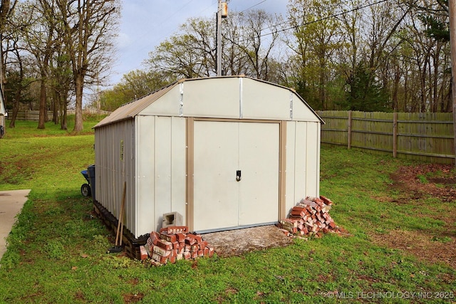 view of shed with fence