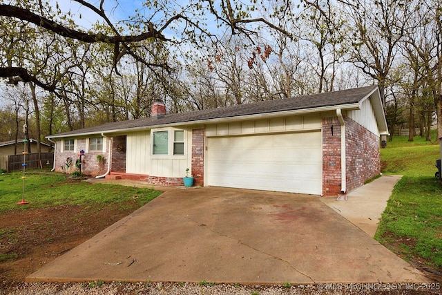 ranch-style house with brick siding, a front lawn, a chimney, and a garage