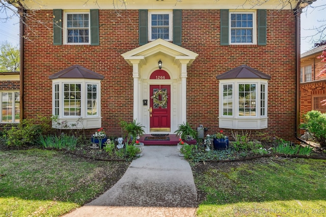 view of front of home with brick siding