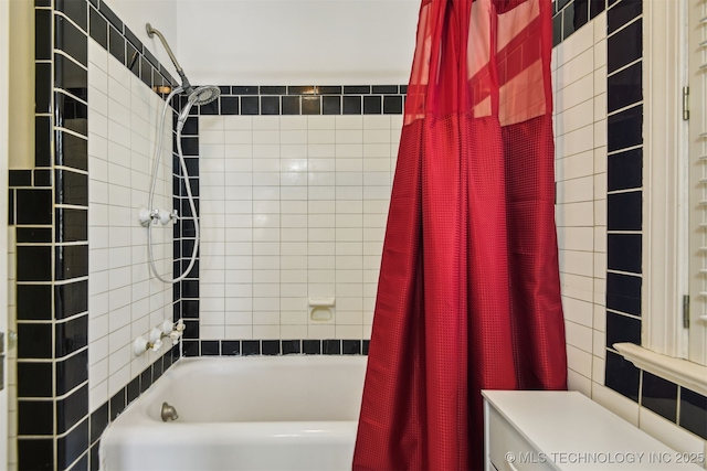 bathroom with shower / bathtub combination with curtain