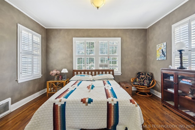 bedroom featuring dark wood-type flooring, visible vents, and baseboards