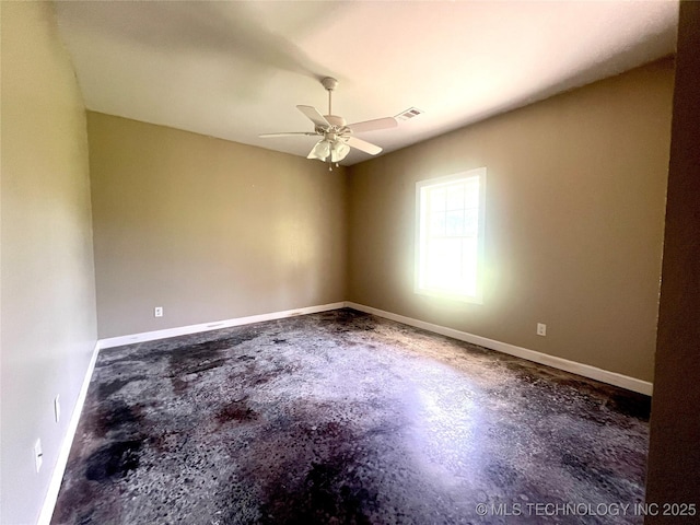 220 Willow Ln, Hartshorne, OK 74547 - empty room featuring unfinished concrete floors, a ceiling fan, and baseboards