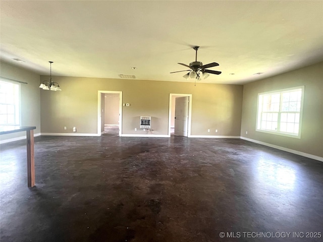220 Willow Ln, Hartshorne, OK 74547 - unfurnished living room with finished concrete flooring, baseboards, heating unit, a chandelier, and a ceiling fan