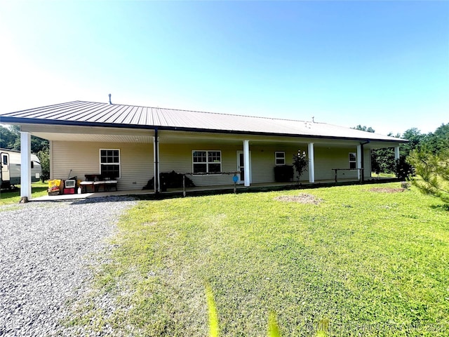 220 Willow Ln, Hartshorne, OK 74547 - back of house with a yard, metal roof, and an attached carport