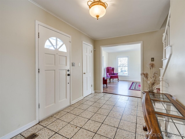 614 Oak Ridge Dr, Sand Springs, OK 74063 - foyer entrance with light tile patterned flooring, ornamental molding, and baseboards
