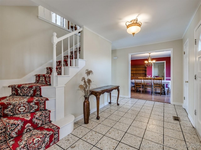 614 Oak Ridge Dr, Sand Springs, OK 74063 - stairway with tile patterned flooring, a chandelier, ornamental molding, and baseboards