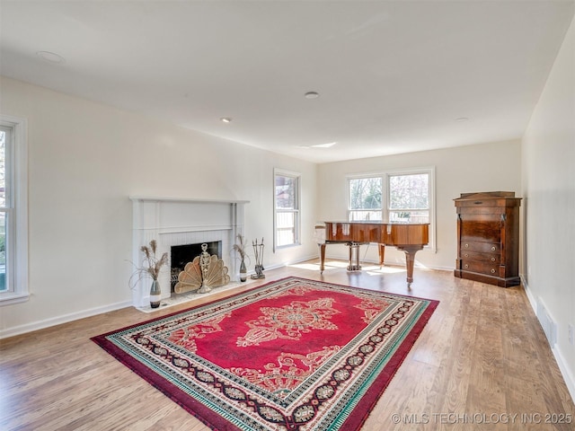 614 Oak Ridge Dr, Sand Springs, OK 74063 - living area featuring wood finished floors, a fireplace, and baseboards