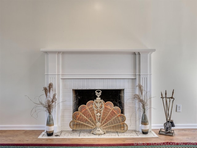 614 Oak Ridge Dr, Sand Springs, OK 74063 - detailed view of a fireplace, wood finished floors, and baseboards
