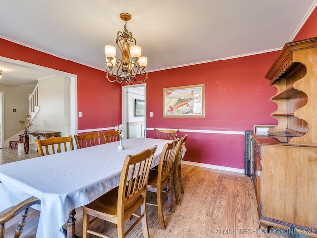 614 Oak Ridge Dr, Sand Springs, OK 74063 - dining area featuring a chandelier, light wood finished floors, and crown molding