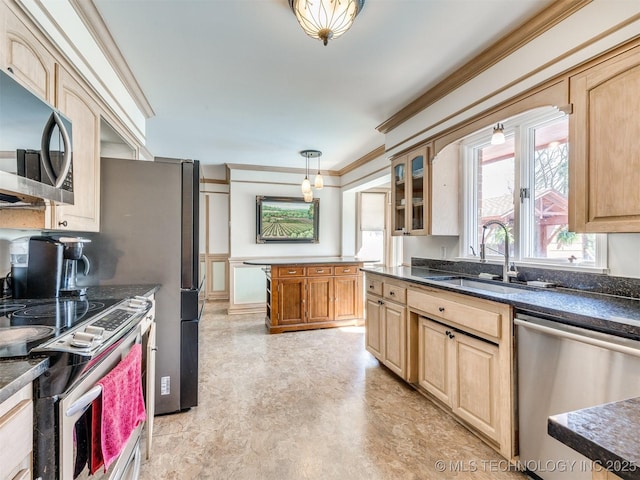 614 Oak Ridge Dr, Sand Springs, OK 74063 - kitchen featuring appliances with stainless steel finishes, a sink, dark countertops, glass insert cabinets, and pendant lighting
