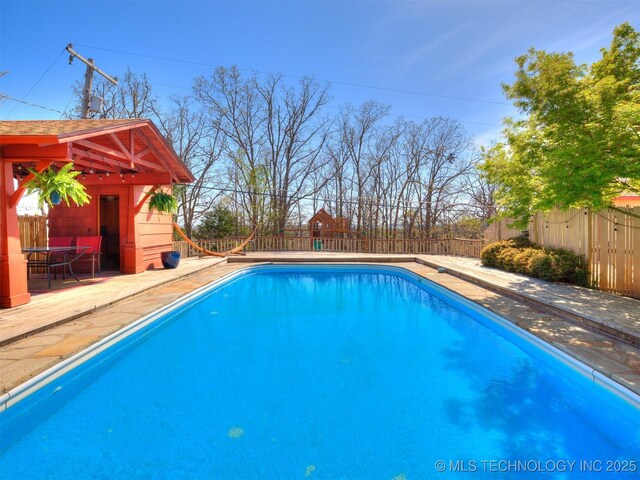 614 Oak Ridge Dr, Sand Springs, OK 74063 - view of pool with a fenced backyard, an outbuilding, and a patio