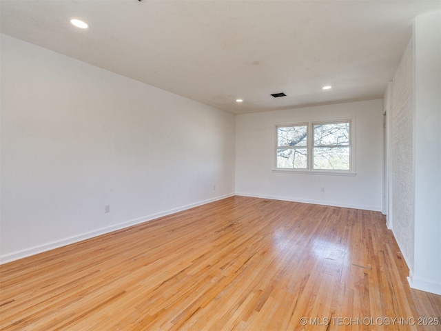 614 Oak Ridge Dr, Sand Springs, OK 74063 - spare room with wood finished floors, baseboards, and recessed lighting
