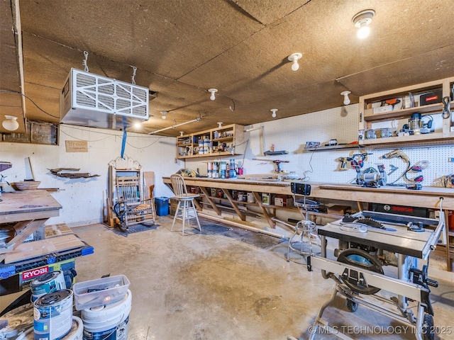 614 Oak Ridge Dr, Sand Springs, OK 74063 - miscellaneous room featuring a workshop area, unfinished concrete floors, and a heating unit