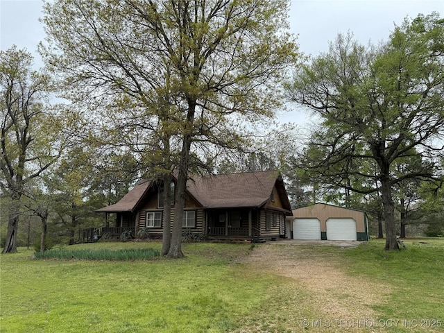 17735 S 75th St E, Warner, OK 74469 - view of front of property with a front lawn, driveway, log siding, an outdoor structure, and a garage