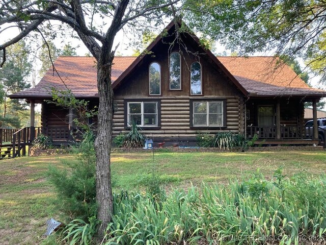 17735 S 75th St E, Warner, OK 74469 - exterior space featuring a porch, a yard, and log siding