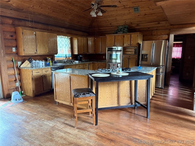 17735 S 75th St E, Warner, OK 74469 - kitchen with light wood-type flooring, visible vents, wooden ceiling, and stainless steel appliances