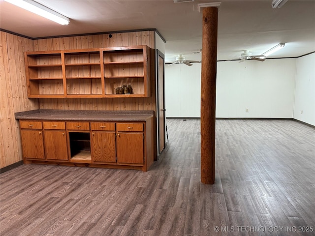 17735 S 75th St E, Warner, OK 74469 - basement with dark wood-type flooring, wooden walls, baseboards, and ceiling fan