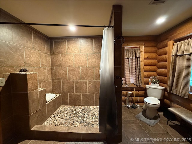 17735 S 75th St E, Warner, OK 74469 - full bathroom with visible vents, log walls, a tile shower, and toilet
