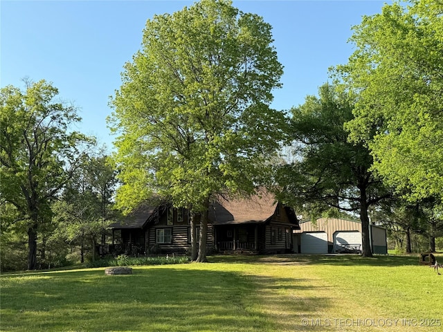 17735 S 75th St E, Warner, OK 74469 - view of yard featuring an outdoor structure and a detached garage