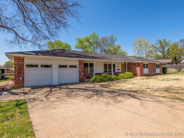 ranch-style house with driveway, an attached garage, a front lawn, brick siding, and fence