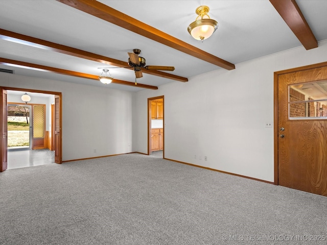 spare room featuring light colored carpet, ceiling fan, and beam ceiling