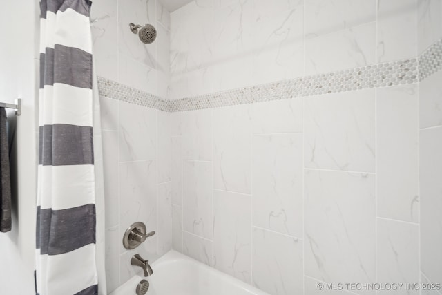 bathroom featuring shower / bathtub combination with curtain