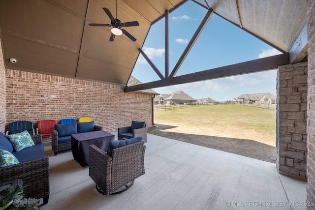 view of patio featuring outdoor lounge area, fence, and a ceiling fan