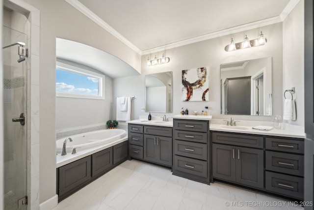 full bathroom with a shower stall, a garden tub, and a sink