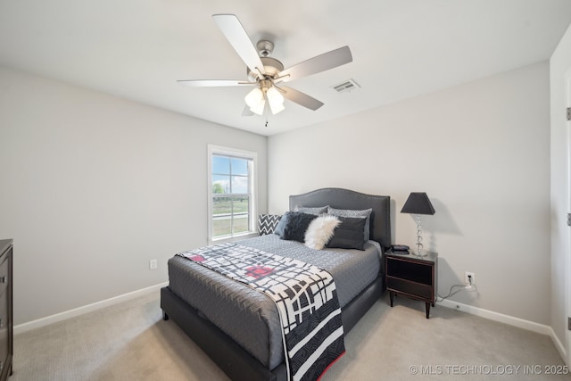 bedroom featuring visible vents, baseboards, a ceiling fan, and light carpet