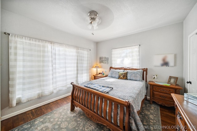 bedroom featuring ceiling fan and wood finished floors