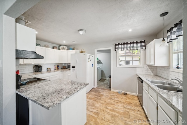 kitchen with white refrigerator with ice dispenser, white cabinets, a healthy amount of sunlight, dishwasher, and a sink