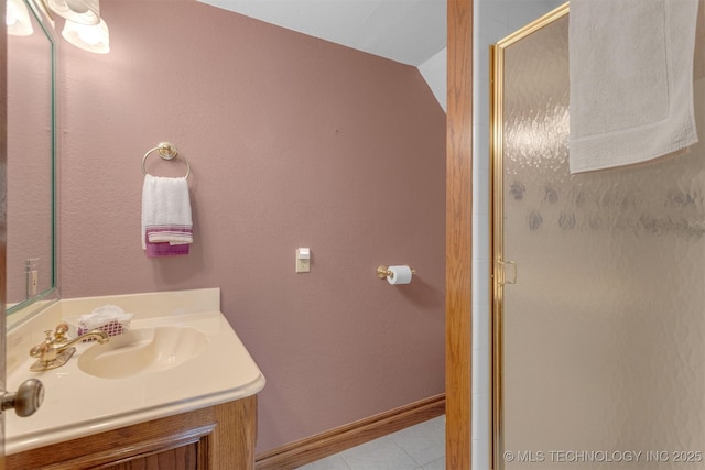 2667 Duguid Ln, Kingston, OK 73439 - bathroom with a stall shower, vanity, tile patterned floors, and baseboards