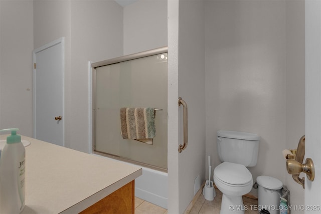 2667 Duguid Ln, Kingston, OK 73439 - full bathroom with toilet, tile patterned floors, and bath / shower combo with glass door