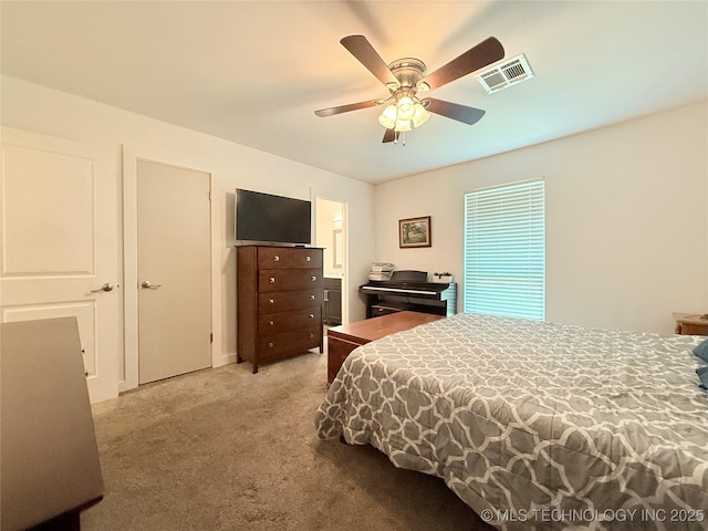 bedroom featuring visible vents, ceiling fan, connected bathroom, and carpet floors
