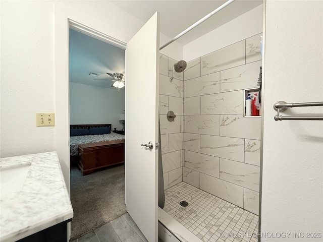 ensuite bathroom featuring a shower stall, connected bathroom, vanity, and a ceiling fan